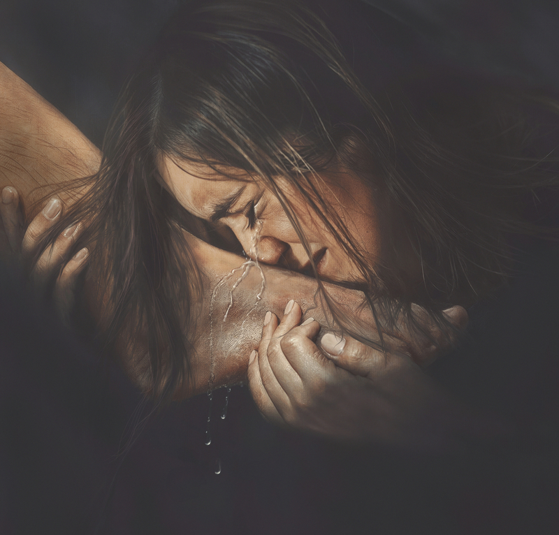 Woman crying on feet of Jesus